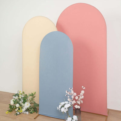 Colorful curved backdrops with floral arrangements in a studio setting.