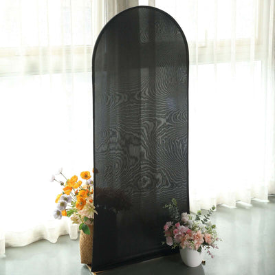 Black decorative screen with flowers in a pot nearby.
