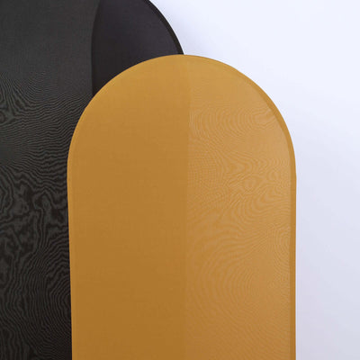 Two textured fabric panels in black and mustard yellow on a white backdrop.