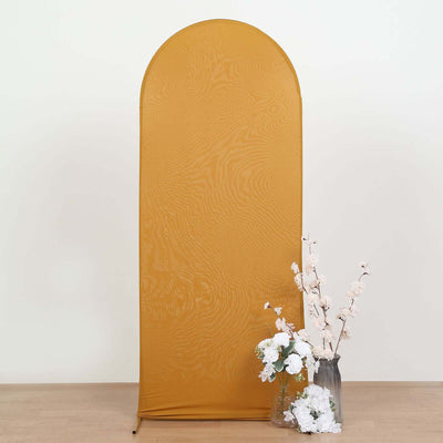Yellow fabric backdrop with arch shape, complemented by floral arrangement.