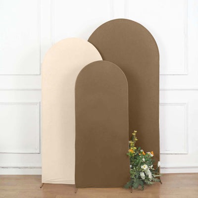 Three arched fabric backdrops in beige and brown with flowers at the base.