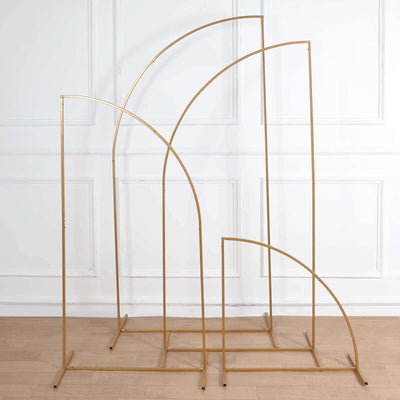 Gold metal arch display stands in various sizes on a white background.
