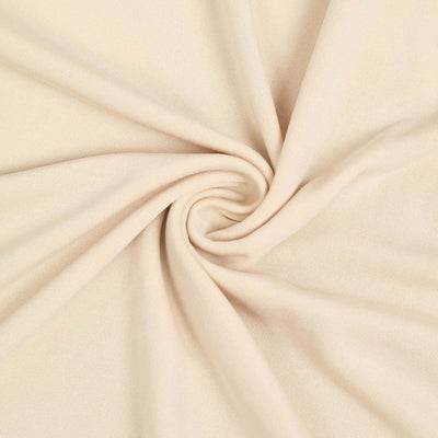 Beige stretchy fabric with a smooth texture, perfect for various sewing projects.