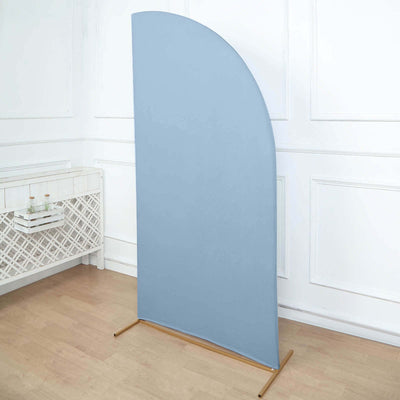 Curved blue fabric backdrop on a wooden stand in a bright interior setting.