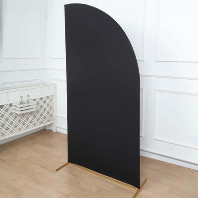 Black curved backdrop stand for photography and events.