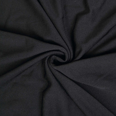 Black fabric texture in a swirling pattern, ideal for clothing and upholstery.