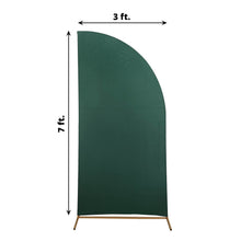 A spandex arch cover in matte hunter emerald green color, shaped like a half moon