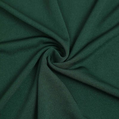 Green fabric texture close-up showcasing soft, smooth material details.