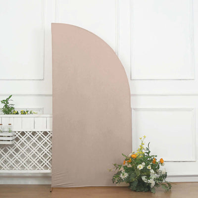 Neutral fabric backdrop with floral arrangement in a studio setting.