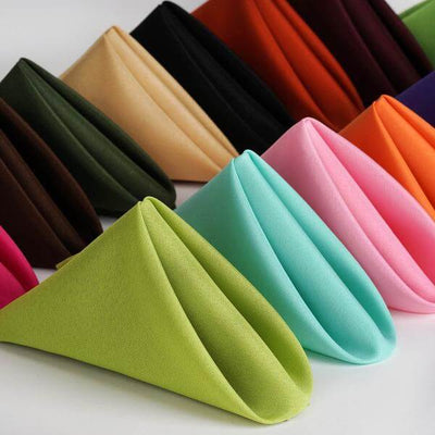 Colorful fabric napkins arranged in a fan shape.