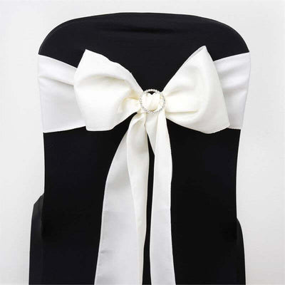 White satin chair sash with bow and rhinestone ring detail