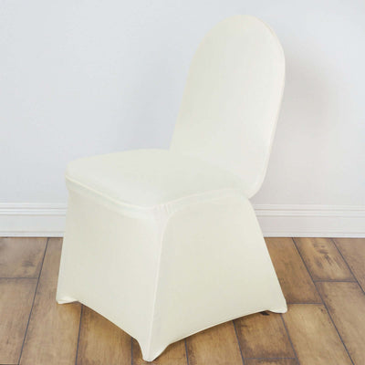 White stretch chair cover on a plain backdrop