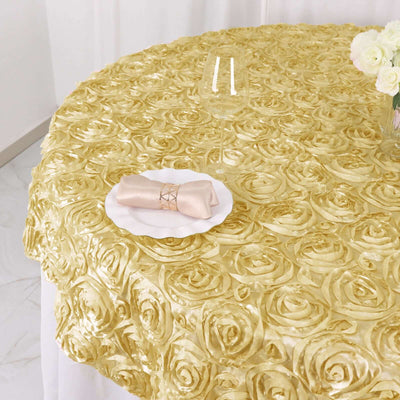 Elegant gold rose-patterned tablecloth with a napkin and plate.