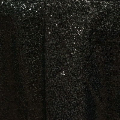 Black sequin fabric with a shimmering texture.