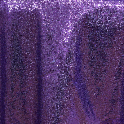 Purple sequin fabric with a shimmering texture.