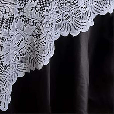 Lace tablecloth with intricate floral design and scalloped edge.