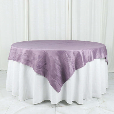 Lavender round tablecloth draped over a white table