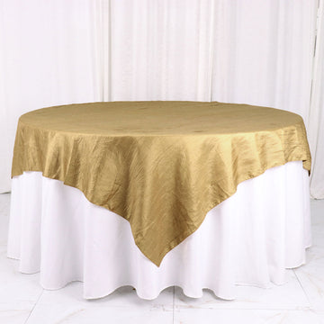 Add Elegance to Your Tablescape with the Gold Accordion Crinkle Taffeta Table Overlay