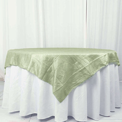 Green tablecloth draped elegantly over a round table