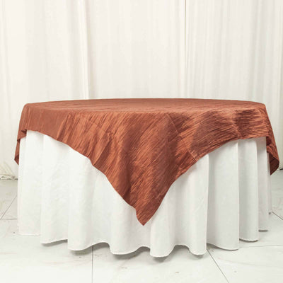 Copper tablecloth draped elegantly over a white table.