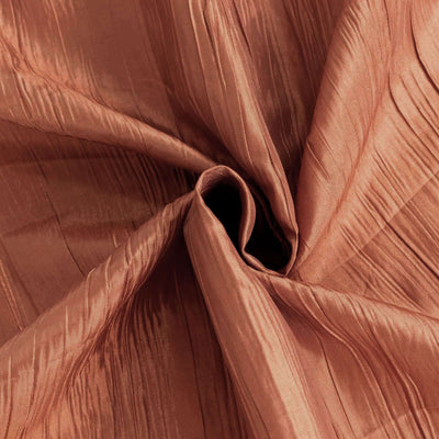 Textured bronze fabric with elegant pleats and a soft sheen.