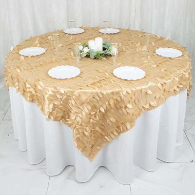 Gold leaf tablecloth on round table set for an elegant dining experience.