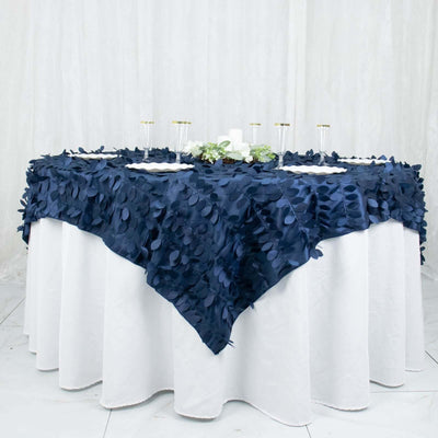 Navy blue tablecloth with leaf design on a round table