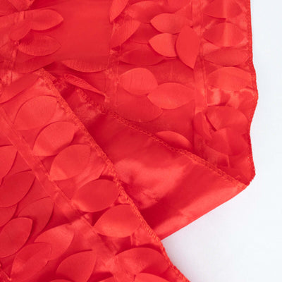 Red fabric with textured leaf motifs, perfect for crafts and decor.