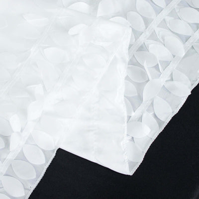 White decorative fabric with leaf patterns and sheer texture.