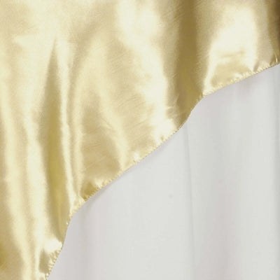 Gold satin fabric with a smooth texture and elegant drape.