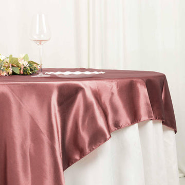 Transform Your Event with the Seamless Satin Square Table Overlay