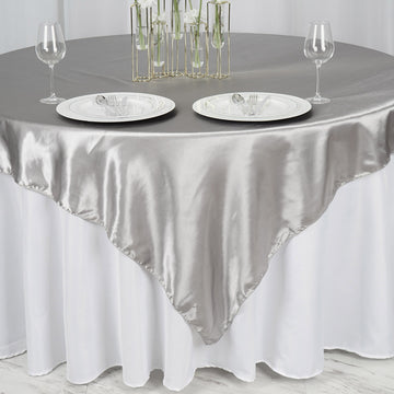 Add a Touch of Elegance with the Silver Seamless Satin Square Tablecloth Overlay