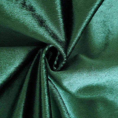 Deep emerald green satin fabric with a smooth texture.