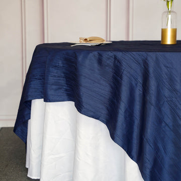 Create a Stunning Tablescape with the Navy Blue Accordion Crinkle Taffeta Square Table Overlay