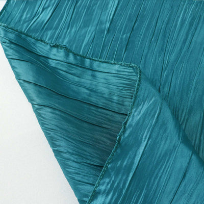 Teal pleated fabric with a smooth texture and elegant drape.