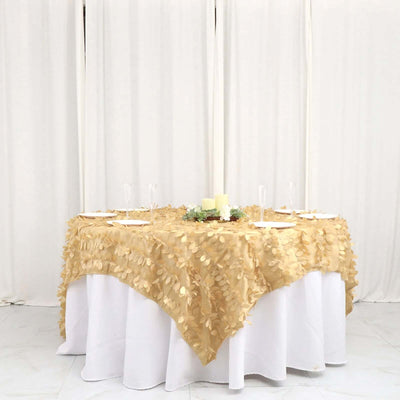 Gold leaf tablecloth on a round table set for an elegant dining experience.