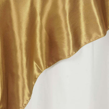 Create a Festive Atmosphere with the Gold Seamless Satin Square Table Overlay