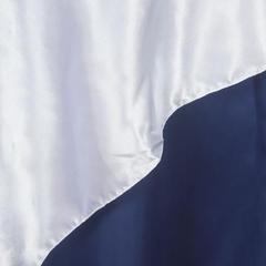 Navy and white fabric draped with smooth texture