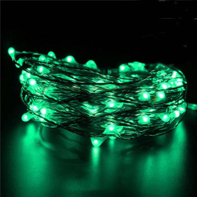 Green LED string lights illuminated on a dark background.