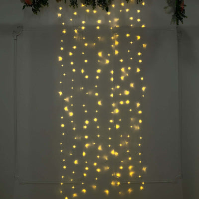 Fairy lights hanging in a curtain design for festive decor.
