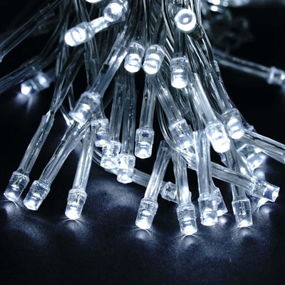 String of bright white LED lights on a dark background.