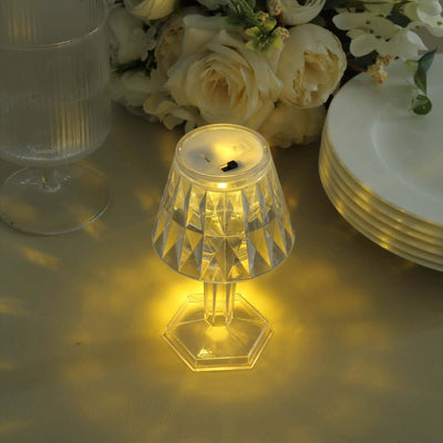 Crystal LED lamp with a diamond pattern, casting warm light.