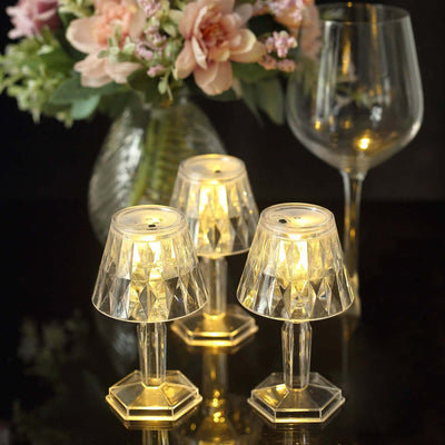 Elegant crystal candle holders with warm LED lights, perfect for home decor.