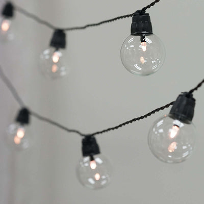String lights with clear bulbs on a black cord.