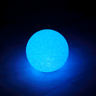 Blue glowing decorative sphere on a dark background.