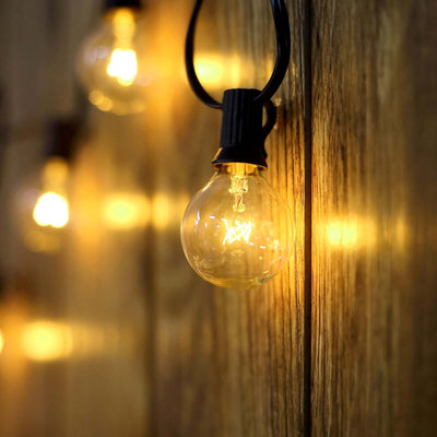 String lights glowing softly against a wooden backdrop.
