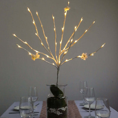 Decorative LED lighted tree centerpiece for dining table.