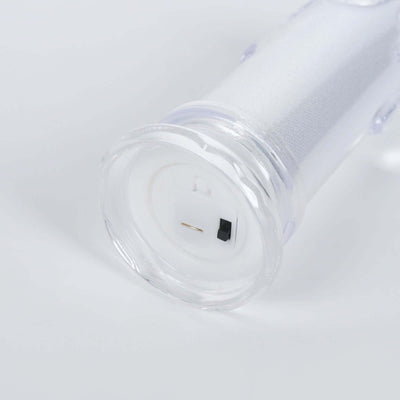 Clear candle holder with a white textured sleeve and black base