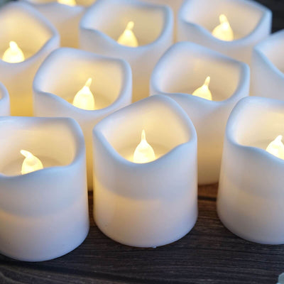 Set of realistic LED candles with soft flickering glow.