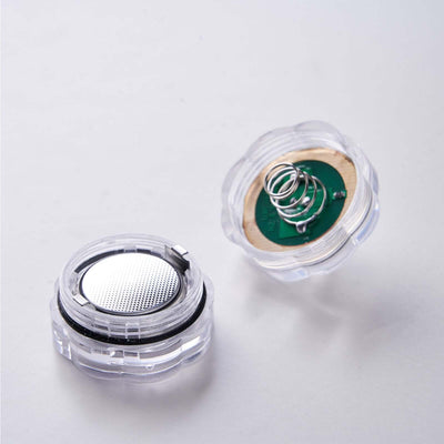 Transparent battery holder with spring and metal contact.